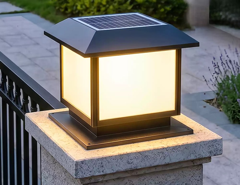 RENYI solar pillar light glowing warm on a gate post